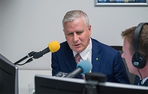 Hon Michael McCormack MP talking into a microphone at ARRB's purpose built Webinar Studio