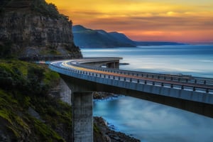 Sunset over the Sea cliff bridge along Australian Pacific ocean coast with lights of passing cars near Sydney, Australia